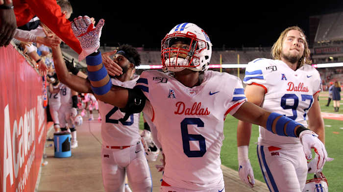 Southern Methodist Mustangs cornerback Sam Westfall (6) is congratulated by the fans following SMU's 34-31 win against the Houston Cougars at TDECU Stadium.
